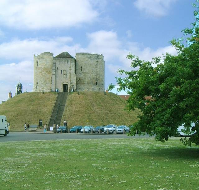 view of Cliffords Tower showing the access stairs. The tower is actually adjacent to a car park.