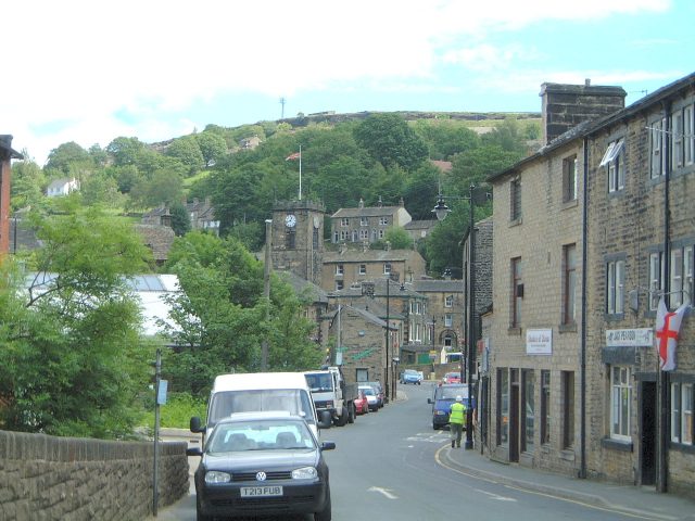 A view looking towards Holmfirth town centre, the world cup football competition was on at the time hence the flag. I believe we were still in with a chance at this time.