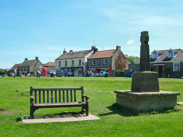 This is the scene of Goathland village green and shops, that introduces most episodes of Heartbeat on TV as the fictional village of Aidensfield. There are no sheep but perhaps they have been crowded out by the tourists.